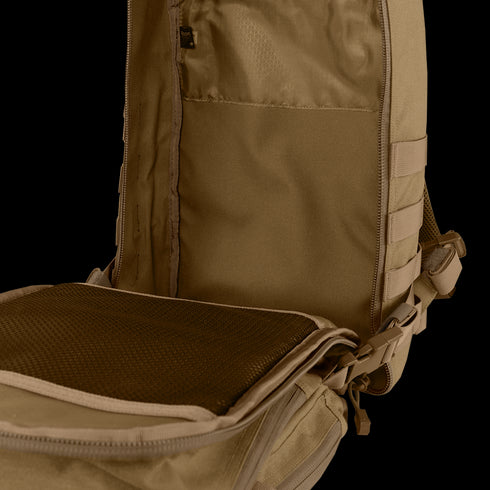 The Condor Compact Assault Backpack Gen II 24L in tan, designed for EDC and bushcraft, features a mesh pocket on the flap and a spacious main compartment with extra storage slots.